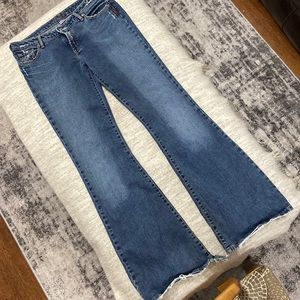 Silver distressed bell bottom jeans low rise
